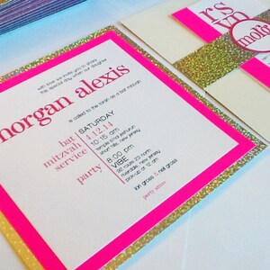 May include: A pink and gold invitation with glitter accents for a bat mitzvah. The invitation includes the name "morgan alexis" and the date "4.12.14".