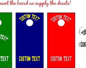 May include: Three cornhole board designs in green, blue, and red, each with a white circle and the text "CUSTOM TEXT". The image also shows decal dimensions: 18 in wide, 6 in high, and 18 in wide, 4 in high. The text "You paint the board we supply the decals!" is at the top.
