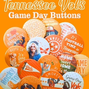 May include: A collection of round pin-back buttons featuring orange and white color schemes with various Tennessee Vols themed graphics, including text like 'My belongs to SMOKEY', 'It's FOOTBALL TIME in Tennessee', and 'Smokey FOR PRESIDENT'.