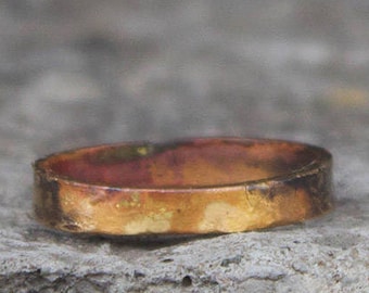 Burnt 18k gold band ring with a wabi sabi organic silhouette. Hammered + oxidized gold ring. Hand crafted.