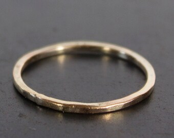 Skinny band ring with a wabi sabi organic silhouette. Hammered + oxidized ring. 10k, 14k, 18k, 22k gold or platinum. Hand crafted.