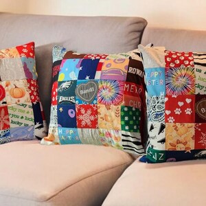 May include: Three colorful patchwork throw pillows with a variety of fabrics and patterns, including tie-dye, plaid, and polka dots. The pillows have personalized embroidered hearts with the names "Bandit" and "Rowan".