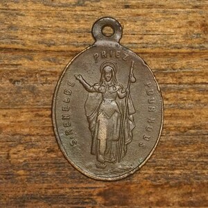 Antique bronze religious medal pendant Saint Reneldis or Saint Renelde Patron Saint against eye diseases