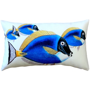 May include: Rectangular decorative pillow featuring a vibrant illustration of several blue fish with yellow fins and accents. The fish are set against a white background. The pillow is designed for home decor.