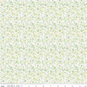 May include: A fabric with a repeating floral pattern. The design features small flowers in shades of green, blue, and pink, set against a cream-colored background. The fabric is likely cotton or a similar material, suitable for quilting or crafting projects.