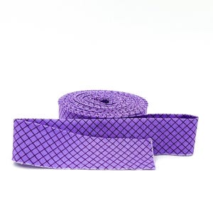 May include: A roll of purple fabric ribbon featuring a repeating black grid pattern. The ribbon is coiled into a circular spool shape with one end extending outward, displaying the consistent diamond-shaped check design across the entire surface.