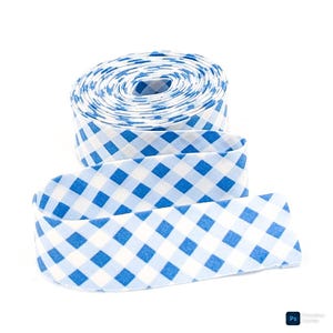 May include: A roll of blue and white gingham ribbon. The ribbon is unrolled, revealing a pattern of blue squares on a white background. The ribbon is likely used for crafts, sewing, or gift wrapping.