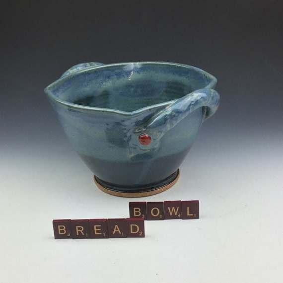 Handmade ceramic serving bread bowl with handles in blue.