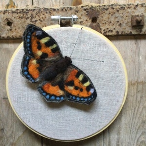 Handmade Needle Felt Small Tortoiseshell butterfly wall art displayed on an embroidery hoop