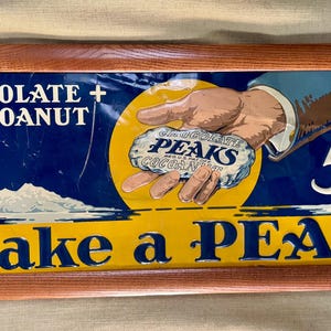Vintage Peaks Chocolate Cocoanut Candy Tin Advertising Sogn with hand