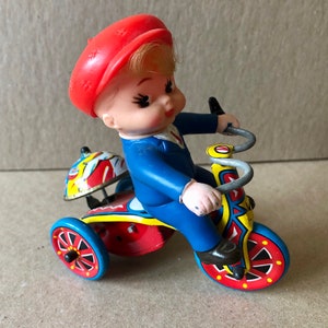 Vintage working Wind Up Boy on Trike Toy
