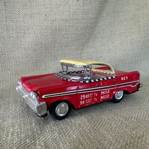 Vintage Japan Tin Friction Taxi Toy