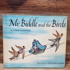 May include: A vintage children's book cover titled "Mr. Biddle and the Birds" by Lonzo Anderson, illustrated by Adrienne Adams. The cover features a whimsical illustration of a man in a blue and white carriage being pulled by birds.