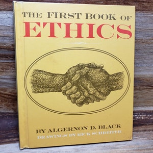 May include: The First Book of Ethics by Algernon D. Black with drawings by Rick Schreitter. The cover is gold with a handshake illustration in the center.
