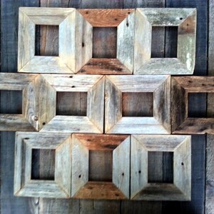 May include: A set of ten rustic wooden picture frames with a distressed finish. The frames are arranged in a grid pattern and have a variety of sizes.
