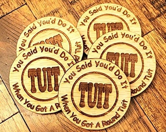 A Round TUIT token. When someone says they will do something "when they get around to it," you just need to hand them one of these!