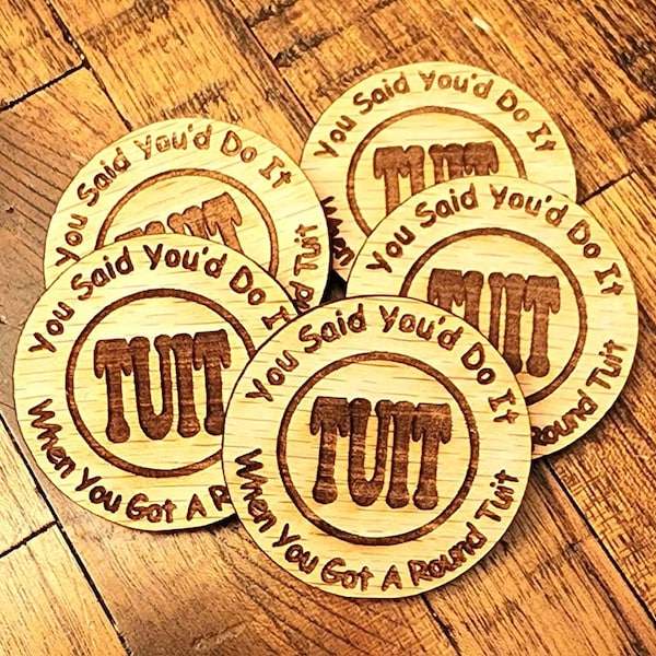 A Round TUIT token. When someone says they will do something "when they get around to it," you just need to hand them one of these!