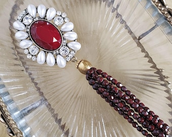 Ornate Brooch Pin  with Garnet Colour Stone and Tassel with Faux Pearl Surround