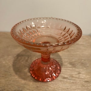 Pink glass teardrop pedestal bowl