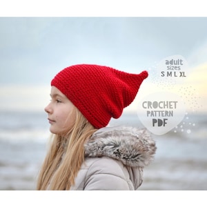 May include: A red crochet beanie hat with a slouchy fit. The hat is being worn by a person with long blonde hair. The image includes the text "adult sizes S M L XL CROCHET PATTERN PDF".