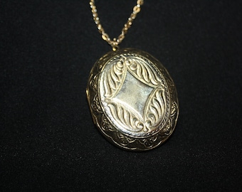 Gold tone large oval locket necklace
