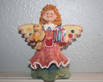 Chubby cheeked craft-like Christmas Angel with Bear and present