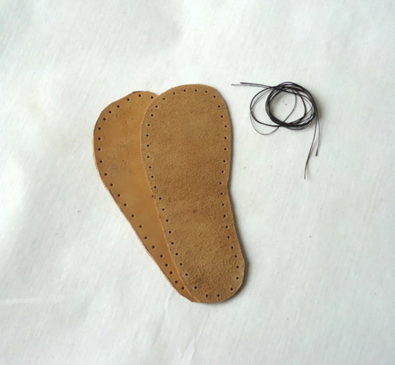 May include: Two brown leather soles with pre-punched holes for stitching. A spool of black thread is included.