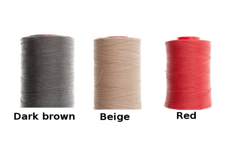 May include: Three spools of waxed thread for leather crafting. The spools are dark brown, beige, and red.