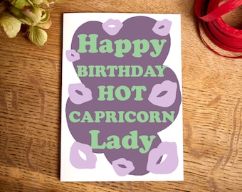 May include: Purple and green birthday card with the text "Happy Birthday Hot Capricorn Lady" and pink lips around the text.