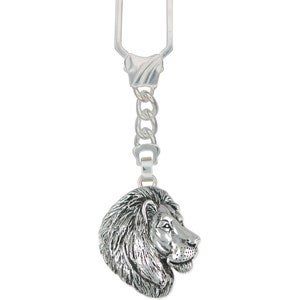 May include: Silver keychain featuring a detailed lion head charm. The keychain has a silver chain and a silver key ring.