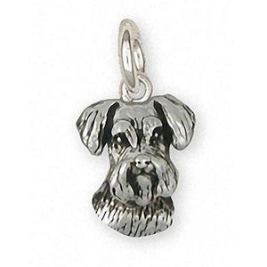 May include: A silver charm in the shape of a miniature Schnauzer dog's head.