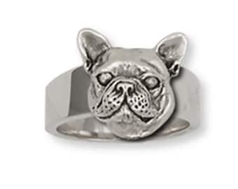 May include: A silver ring featuring a detailed French Bulldog head design.