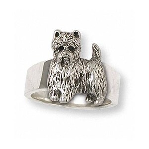 May include: A silver ring featuring a detailed West Highland White Terrier dog design.