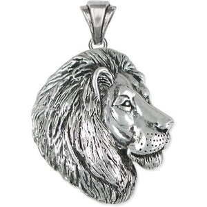May include: Silver pendant featuring a detailed lion head profile with a mane. The lion is facing to the right and has a realistic appearance.
