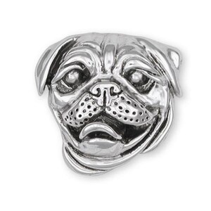 May include: A silver charm featuring a detailed pug dog head.