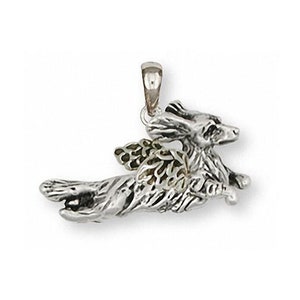 May include: Sterling silver pendant charm of a running dog with angel wings. The wings are made of gold-tone metal.