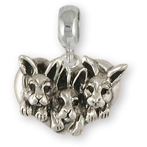 May include: Sterling silver charm featuring three adorable bunny rabbits huddled together in a heart shape.