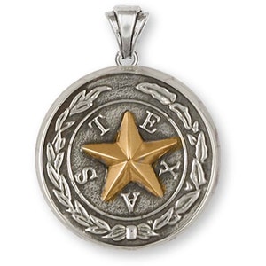 May include: Silver pendant with a gold-colored five-pointed star in the center. The star is surrounded by a circle with the word "TEXAS" inscribed around it. The circle is surrounded by a wreath of leaves.