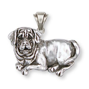 May include: Silver pendant charm of a Mastiff dog lying down. The dog is depicted in a realistic style with detailed features.