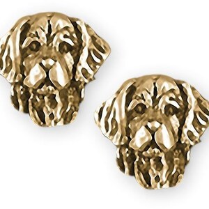 May include: Gold-tone earrings featuring a detailed golden retriever dog head design.