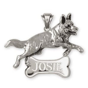 May include: Silver German Shepherd dog charm pendant with a bone-shaped tag engraved with the name "JOSIE".