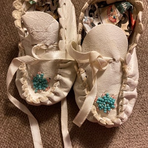 White beaded baby or doll moccasins with white ribbon
