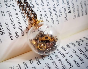 Floating clock glass pendant, steampunk clock pieces within a glass globe.