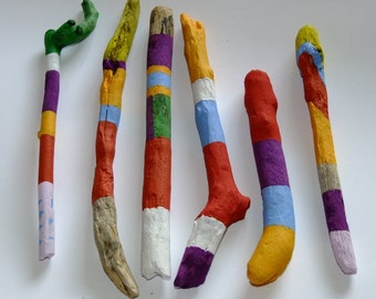 Colourful driftwood hand painted vase fillers, ideal for decorating a room when your flowers have died and you have an empty vase.