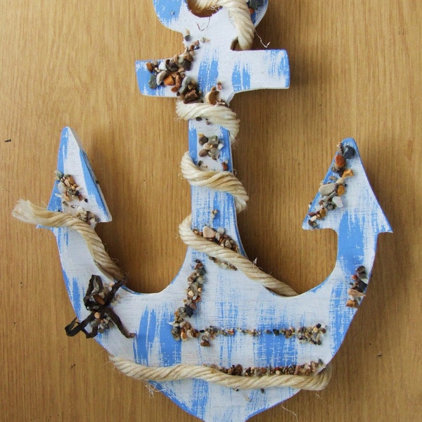 Decorative wooden blue ships anchor wallhanging or decoration for beach hut or seaside cottage.