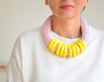 Pink statement necklace made of cotton and clay