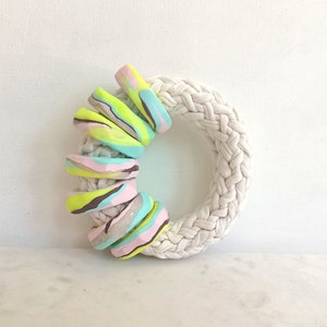 Oversized bangle bracelet made of t-shirt yarn and polymer clay.