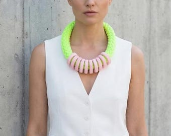 Bright green statement necklace with light pink hoops