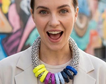Massive statement necklace; blue and neon accents