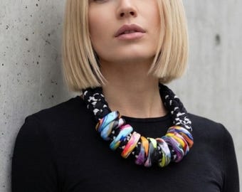 Colourful statement necklace; heavy, rich textured, maximalist style